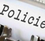 Typewriter with heading Policies displayed